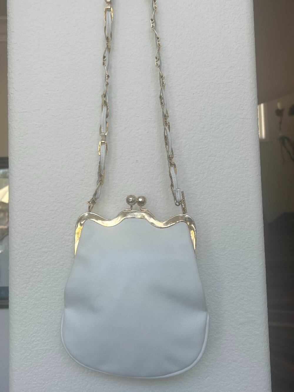 White leather pouch silhouette evening bag.